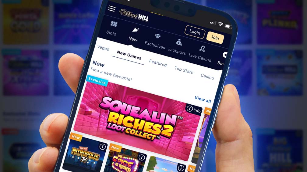 William Hill online casino homepage with colorful game graphics and promotional banners